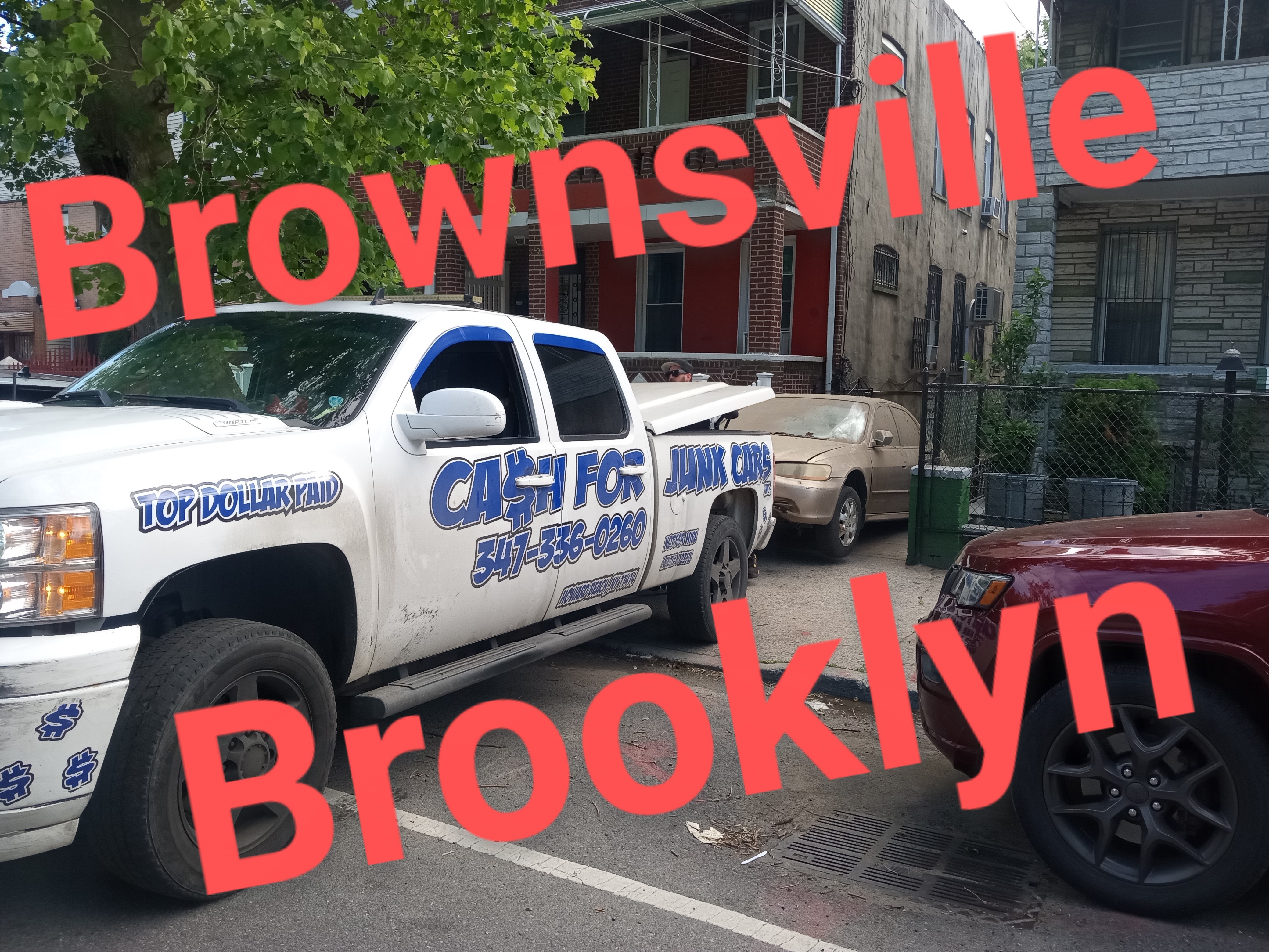 truck pulling a vehickle from owners driveway in Brownsville Brooklyn, NY