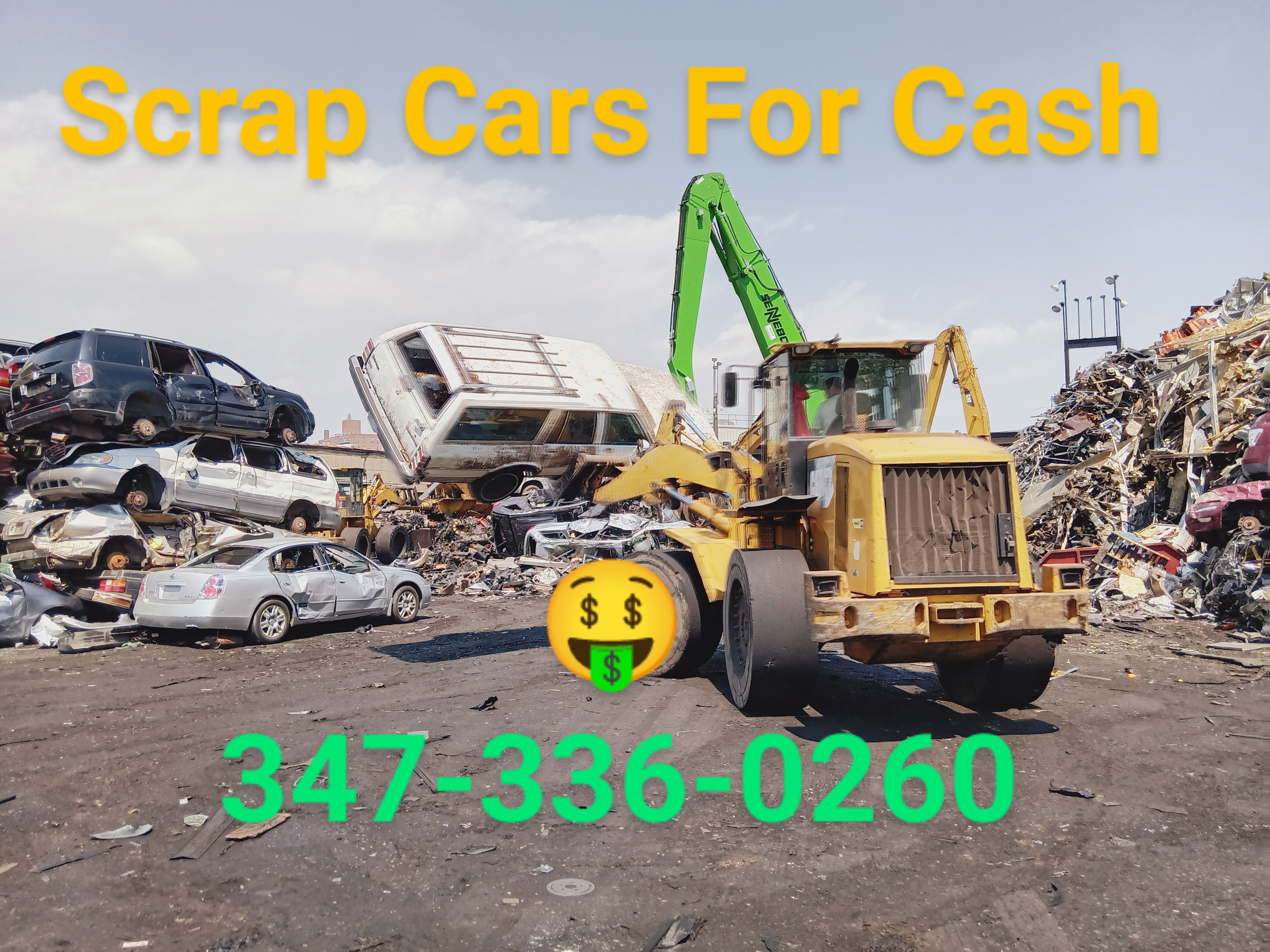 our truck in front of a large, stacked pile of recycled vehicles