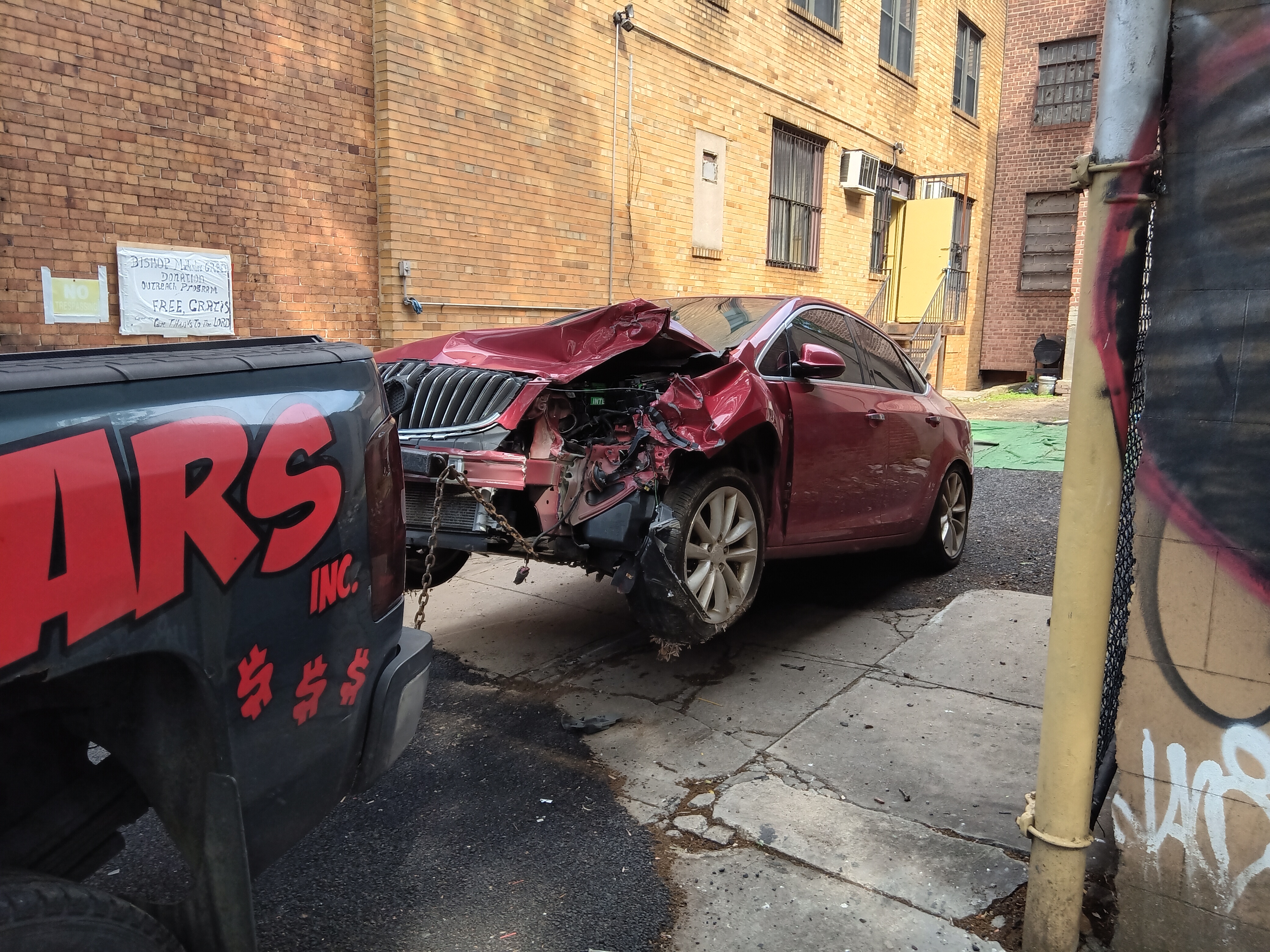junk car removal of a car with heavy front damaged from a storage lot 
